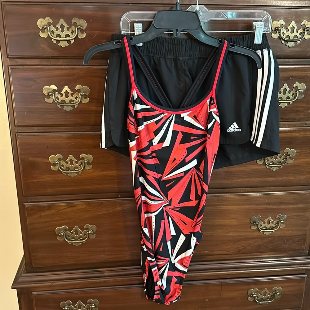 Women’s Dolfin one piece racer back swimsuit with matching adidas shorts.
